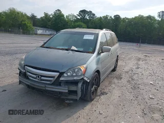 2005 Honda Odyssey TOURING with VIN 5FNRL38815B027811, listed as a IAAI auction lot 42105642 with 303,913 mi miles. Bid and sale history available at carsss.com. Image 2.