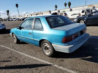 1991 Plymouth Sundance z VIN 1P3XP24D6MN564571, wystawiony jako Copart lot #78415044 z przebiegiem 50 625 mil mil oraz Tytuł czysty. Historia ofert i sprzedaży dostępna na DreamBid. Obrazek 2.
