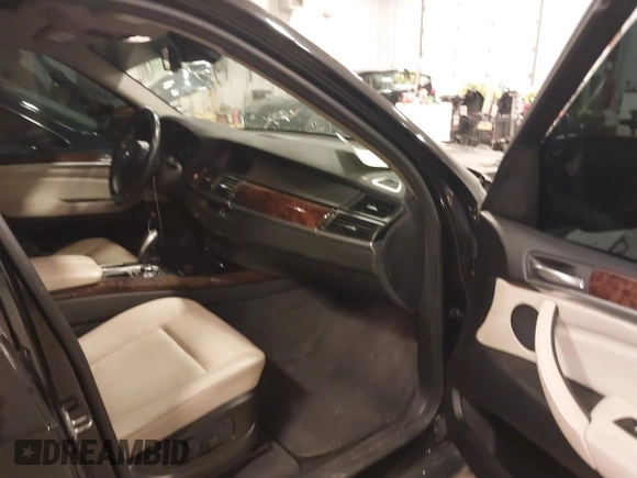 2012 BMW X5 35i with VIN 5UXZV4C55CL990510, listed as a IAAI auction lot 41849293 with 117,522 mi miles and . Bid and sale history available at DreamBid. Image 5.