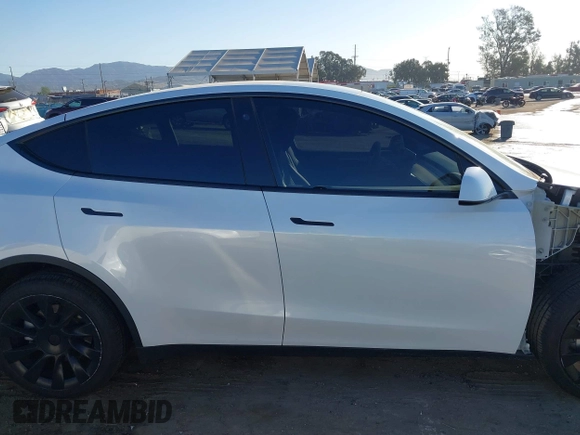2023 Tesla Model Y Long Range with VIN 7SAYGDEE1PA128818, listed as a IAAI auction lot 41622062 with 19,089 mi miles. Bid and sale history available at carsss.com. Image 14.