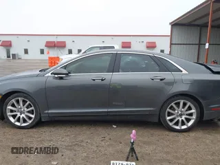 2015 Lincoln MKZ z VIN 3LN6L2G99FR604894, wystawiony jako IAAI lot #41433264 z przebiegiem 262 472 mil mil oraz . Historia ofert i sprzedaży dostępna na DreamBid. Obrazek 15.