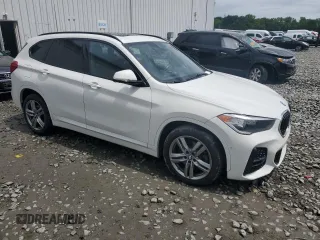 2021 BMW X1 xDrive28i with VIN WBXJG9C07M3M67312, listed as a Copart auction lot 59712835 with 62,371 mi miles and Salvage title. Bid and sale history available at DreamBid. Image 4.