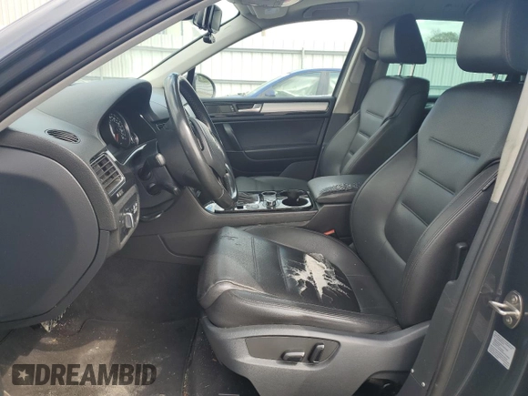 2012 Volkswagen Touareg Sport с VIN WVGEK9BP7CD006059, выставлен на аукционе Copart как лот 49411245 с пробегом 202 323 миль миль и Чистый • Clean title. История ставок и продаж доступна на DreamBid. Изображение 7.