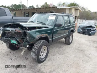 1999 Jeep Cherokee Sport with VIN 1J4FF68S1XL555463, listed as a IAAI auction lot 41898076 with 206,656 mi miles. Bid and sale history available at carsss.com. Image 17.