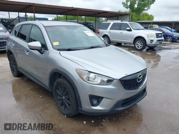 2014 Mazda CX-5 Touring z VIN JM3KE2CY8E0369145, wystawiony jako IAAI lot #42462985 z przebiegiem 155 480 mil mil oraz . Historia ofert i sprzedaży dostępna na DreamBid. Obrazek 1.
