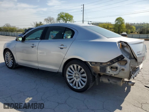 2013 Lincoln MKS with VIN 1LNHL9EK0DG612314, listed as a Copart auction lot 52901685 with 124,828 mi miles and Salvage title. Bid and sale history available at DreamBid. Image 2.