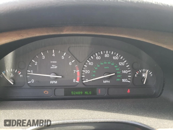 2002 Jaguar S-Type with VIN SAJDA03P22GM36867, listed as a Copart auction lot 79027454 with 52,489 mi miles and Salvage Title. Bid and sale history available at DreamBid. Image 9.