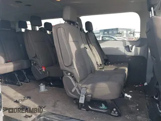 2018 Ford Transit Passenger XL with VIN 1FBZX2YM0JKA70128, listed as a IAAI auction lot 42379000 with 125,309 mi miles and . Bid and sale history available at DreamBid. Image 8.