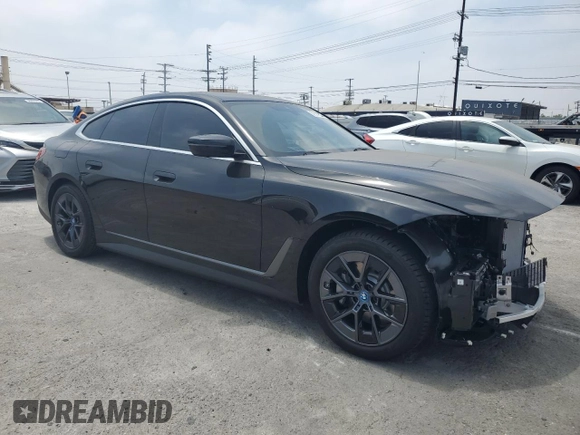 2024 BMW i4 eDrive35 with VIN WBY43AW02RFT03098, listed as a Copart auction lot 57317884 with 203 mi miles and Salvage Title. Bid and sale history available at carsss.com. Image 4.
