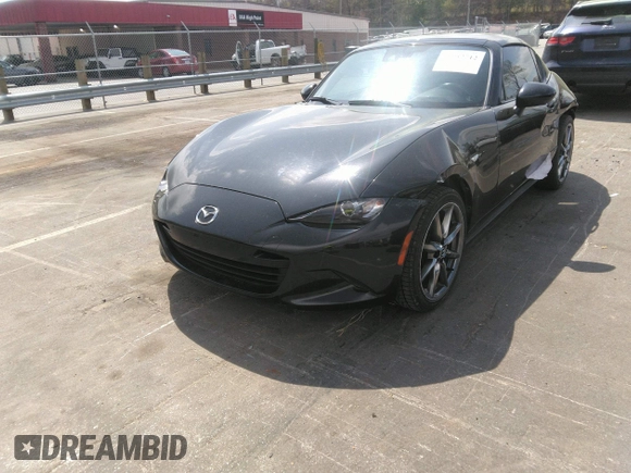 2021 Mazda MX-5 Miata Grand Touring z VIN JM1NDAM75M0451597, wystawiony jako IAAI lot #41932712 z przebiegiem 61 710 mil mil oraz . Historia ofert i sprzedaży dostępna na DreamBid. Obrazek 21.
