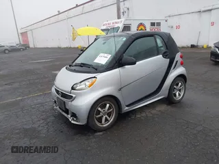 2015 Smart fortwo Passion with VIN WMEEJ3BA9FK819985, listed as a IAAI auction lot 41879486 with 79,394 mi miles. Bid and sale history available at carsss.com. Image 2.