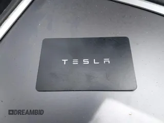 2021 Tesla Model 3 Standard Range Plus z VIN 5YJ3E1EA5MF977437, wystawiony jako IAAI lot #40297512 z przebiegiem 72 039 mil mil oraz . Historia ofert i sprzedaży dostępna na DreamBid. Obrazek 11.
