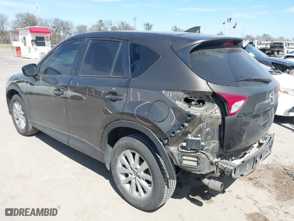 2016 Mazda CX-5 Touring with VIN JM3KE2CY0G0860828, listed as a IAAI auction lot 41666052 with NaN miles. Bid and sale history available at carsss.com. Image 3.