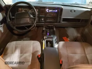 1996 Jeep Cherokee Sport with VIN 1J4FJ68S1TL226495, listed as a Copart auction lot 58587685 with 205,397 mi miles and Salvage title. Bid and sale history available at DreamBid. Image 8.