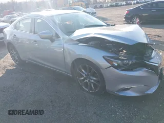 2017 Mazda 6 Grand Touring with VIN JM1GL1W50H1132261, listed as a IAAI auction lot 41930610 with 54,431 mi miles and . Bid and sale history available at DreamBid. Image 1.