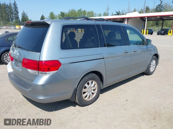 2009 Honda Odyssey EX-L with VIN 5FNRL38779B013943, listed as a IAAI auction lot 42119422 with 147,285 mi miles. Bid and sale history available at carsss.com. Image 4.