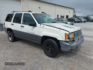 1996 Jeep Grand Cherokee Laredo with VIN 1J4FX58S1TC278511, listed as a IAAI auction lot 41837339 with 303,947 mi miles. Bid and sale history available at carsss.com. Image 1.