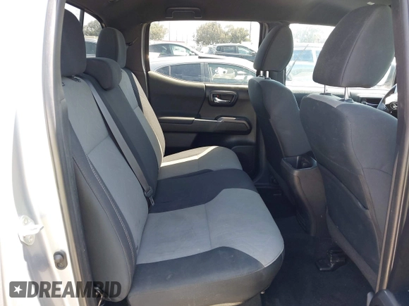 2021 Toyota Tacoma SR with VIN 3TMCZ5AN6MM393306, listed as a IAAI auction lot 42094095 with 57,217 mi miles and . Bid and sale history available at DreamBid. Image 8.