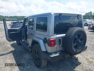 2021 Jeep Wrangler Unlimited Sahara with VIN 1C4HJXEN3MW628845, listed as a IAAI auction lot 42438049 with 49,970 mi miles and . Bid and sale history available at DreamBid. Image 3.