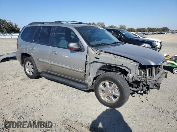 2002 GMC Envoy SLE z VIN 1GKDS13S822359901, wystawiony jako Copart lot #71940774 z przebiegiem 188 580 mil mil oraz Szkoda całkowita • Salvage title. Historia ofert i sprzedaży dostępna na DreamBid. Obrazek 4.
