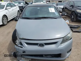 2013 Scion tC with VIN JTKJF5C7XD3046764, listed as a IAAI auction lot 41881930 with 87,701 mi miles. Bid and sale history available at carsss.com. Image 12.