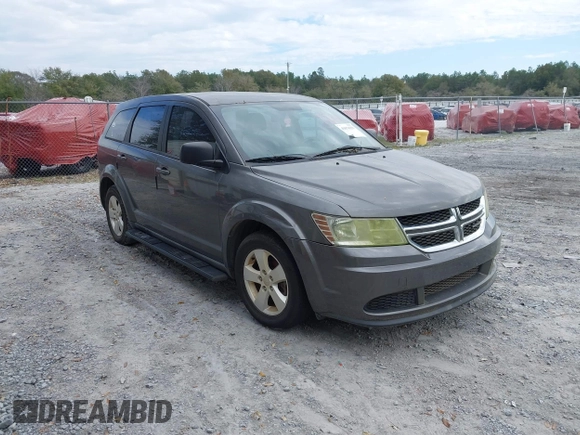 2013 Dodge Journey SE z VIN 3C4PDCAB2DT577805, wystawiony jako IAAI lot #41674351 z przebiegiem 183 006 mil mil oraz . Historia ofert i sprzedaży dostępna na DreamBid. Obrazek 1.