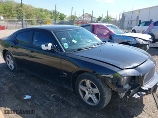 2009 Dodge Charger SXT with VIN 2B3KA33V39H593071, listed as a IAAI auction lot 39318736 with 133,685 mi miles. Bid and sale history available at carsss.com. Image 1.