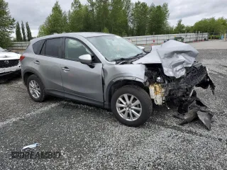 2014 Mazda CX-5 Touring z VIN JM3KE4CYXE0426408, wystawiony jako Copart lot #57355115 z przebiegiem Nie podano mil oraz Szkody całkowita. Historia ofert i sprzedaży dostępna na DreamBid. Obrazek 4.
