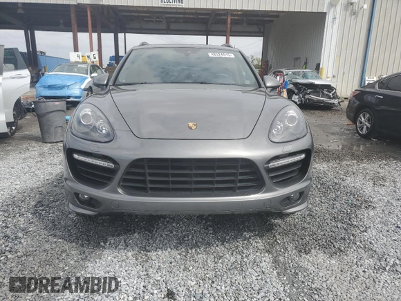 2014 Porsche Cayenne GTS с VIN WP1AD2A22ELA70950, выставлен на аукционе Copart как лот 48324015 с пробегом 75 310 миль миль и На запчасти • Non repairable. История ставок и продаж доступна на DreamBid. Изображение 5.