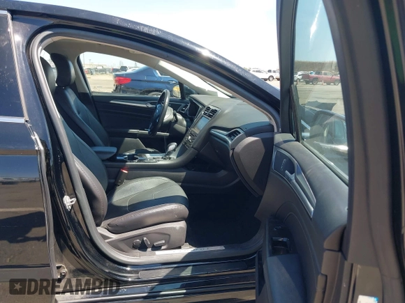 2016 Ford Fusion Titanium Hybrid z VIN 3FA6P0RUXGR123445, wystawiony jako IAAI lot #42606596 z przebiegiem 145 541 mil mil oraz . Historia ofert i sprzedaży dostępna na DreamBid. Obrazek 5.
