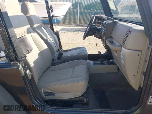 2004 Jeep Wrangler SE with VIN 1J4FA29144P797861, listed as a IAAI auction lot 42624721 with 156,867 mi miles and . Bid and sale history available at DreamBid. Image 5.