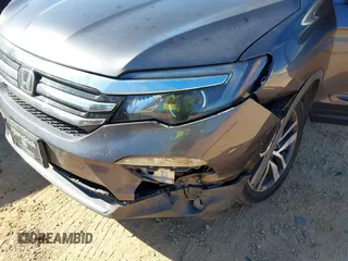 2017 Honda Pilot Touring with VIN 5FNYF5H92HB038893, listed as a IAAI auction lot 41639555 with 100,354 mi miles. Bid and sale history available at carsss.com. Image 6.
