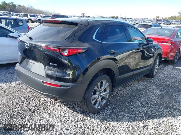 2023 Mazda CX-30 S Premium with VIN 3MVDMBDM7PM528297, listed as a IAAI auction lot 41637542 with 48,935 mi miles and . Bid and sale history available at DreamBid. Image 4.