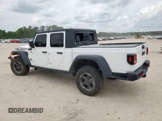 2023 Jeep Gladiator Rubicon with VIN 1C6JJTBG8PL532271, listed as a Copart auction lot 58220565 with 34,172 mi miles and Salvage title. Bid and sale history available at DreamBid. Image 2.