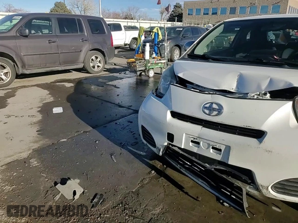 2014 Scion iQ with VIN JTNJJXB01EJ026837, listed as a Copart auction lot 43596385 with 52,826 mi miles and Salvage title. Bid and sale history available at DreamBid. Image 12.