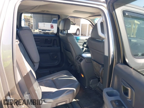 2007 Honda Ridgeline RTL z VIN 2HJYK16557H531198, wystawiony jako IAAI lot #41998612 z przebiegiem 194 975 mil mil oraz . Historia ofert i sprzedaży dostępna na DreamBid. Obrazek 8.