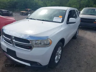 2013 Dodge Durango SXT with VIN 1C4RDJAG4DC512491, listed as a IAAI auction lot 42276406 with 219,766 mi miles and . Bid and sale history available at DreamBid. Image 2.