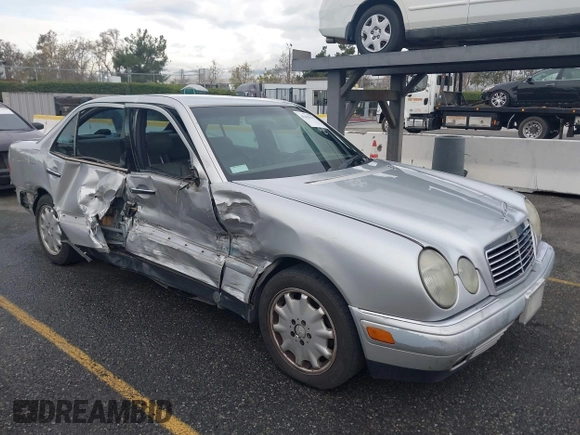 1997 Mercedes-Benz E-Class with VIN WDBJF55FXVJ033553, listed as a IAAI auction lot 41425117 with 280,019 mi miles. Bid and sale history available at carsss.com. Image 1.