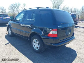 2001 Mercedes-Benz M-Class with VIN 4JGAB54E41A232917, listed as a IAAI auction lot 42055379 with 187,008 mi miles. Bid and sale history available at carsss.com. Image 3.