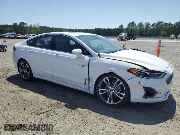 2020 Ford Fusion Titanium с VIN 3FA6P0K99LR174094, выставлен на аукционе Copart как лот 52583435 с пробегом 98 389 миль миль и Списание • Salvage title. История ставок и продаж доступна на DreamBid. Изображение 4.