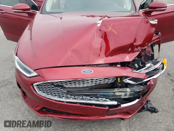 2019 Ford Fusion Titanium z VIN 3FA6P0D99KR221328, wystawiony jako Copart lot #57104515 z przebiegiem 138 427 mil mil oraz Szkoda całkowita • Salvage title. Historia ofert i sprzedaży dostępna na DreamBid. Obrazek 11.