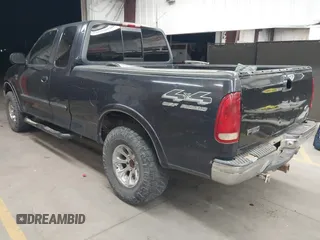 1999 Ford F-150 XL with VIN 1FTRX18L5XKB05347, listed as a IAAI auction lot 41885737 with 250,070 mi miles. Bid and sale history available at carsss.com. Image 3.