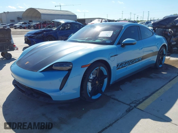 2022 Porsche Taycan with VIN WP0AA2Y10NSA10908, listed as a IAAI auction lot 42257582 with 23,806 mi miles and . Bid and sale history available at DreamBid. Image 2.