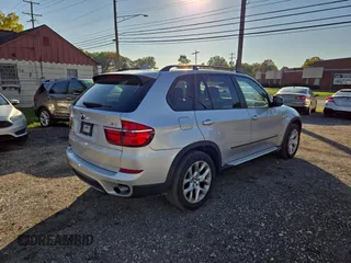 2011 BMW X5 35i with VIN 5UXZV4C54BL410887, listed as a Copart auction lot 77017594 with 111,629 mi miles and Clean Title. Bid and sale history available at carsss.com. Image 4.