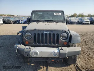 2011 Jeep Wrangler Unlimited Sahara with VIN 1J4BA5H10BL634002, listed as a Copart auction lot 75035234 with 139,182 mi miles and Salvage Title. Bid and sale history available at carsss.com. Image 5.
