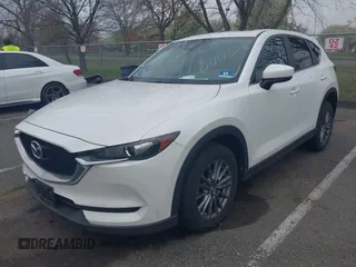 2017 Mazda CX-5 Touring with VIN JM3KFACL5H0189296, listed as a IAAI auction lot 42042328 with 60,208 mi miles and . Bid and sale history available at carsss.com. Image 2.
