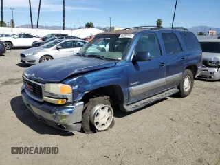 2001 GMC Yukon SLT with VIN 1GKEC13T21J264040, listed as a Copart auction lot 46282145 with 136,264 mi miles and Salvage Title. Bid and sale history available at carsss.com. Image 1.