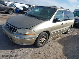 1999 Ford Windstar Wagon SE with VIN 2FMZA5249XBB38156, listed as a IAAI auction lot 42044714 with 199,285 mi miles. Bid and sale history available at carsss.com. Image 2.