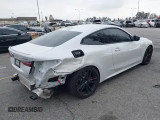 2022 BMW 4 Series 430i with VIN WBA53AP02NCK91287, listed as a IAAI auction lot 41448686 with 27,046 mi miles and . Bid and sale history available at carsss.com. Image 4.