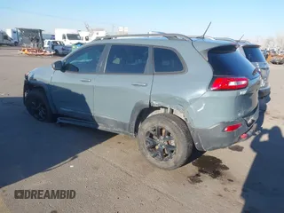 2015 Jeep Cherokee Trailhawk with VIN 1C4PJMBS3FW510219, listed as a IAAI auction lot 41440297 with 144,012 mi miles and . Bid and sale history available at DreamBid. Image 3.